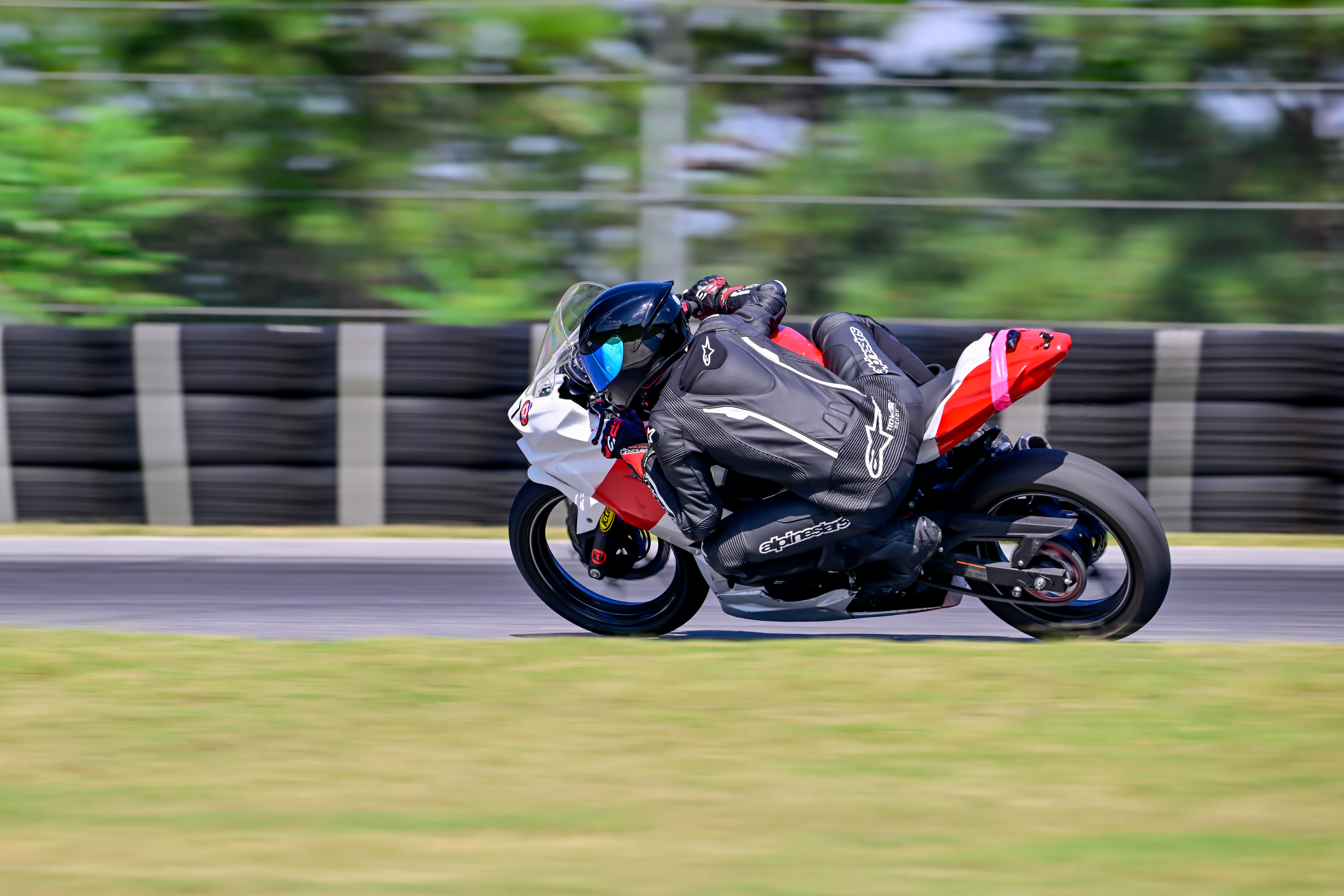Aero riding a motorcycle on a race track